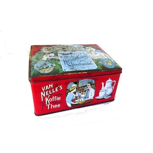 May include: A vintage red rectangular tin with the words "VAN NELLE'S Koffie Thee" in white. The lid features illustrations of people and text in Dutch. The side shows a scene with a woman and a man behind a counter, with a teapot and cups.