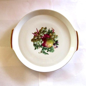Ceramic vintage white round gold trim cake fruit platter. Fruit bouquet handled gold rimmed cake plate.