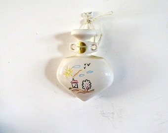 White pottery handled wall vase with a naive child like drawing