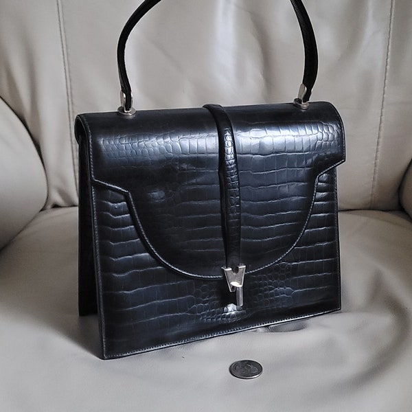 Stylish, Mid Century Mastercraft formal handbag in snakelike skin pattern exterior finish.