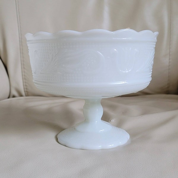 E. O. Brody Co pedestal white glass embossed bowl 6" tall.
