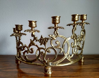 Centerpiece brass vintage candle holder. Six candles, bow shaped ornate display candelabra.