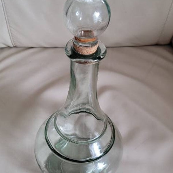 Vintage glass bottle decanter Carafe with blown glass stopper elegant barware addition.