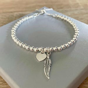 Bracciale con ciondolo a forma di cuore con piuma in argento sterling, chiusura scorrevole regolabile, bracciale con perline a forma di sfera, regalo per lei.