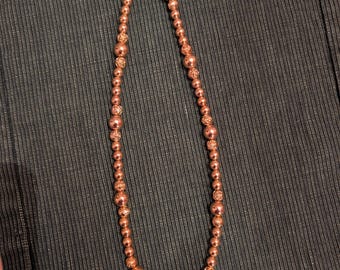 Signed Roge't gold tone beaded necklace, size 24 inches long, circa 1971.