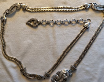 Signed Brighton silver tone chain link belt, 38 inches in length, with additional links to adjust fit.