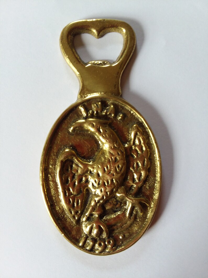 American Mid-Century Brass Bottle opener size 4 14 x 2 inches.