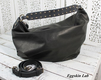 Italian black leather purse, shoulder bag and cross body, the handle made of sturdy leather is covered with small round studs, hobo handbag