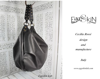 Astrea is a roomy and soft shoulder bag, crossbody bag in black leather, hobo italian leather purse with studs on handle, minimalist handbag