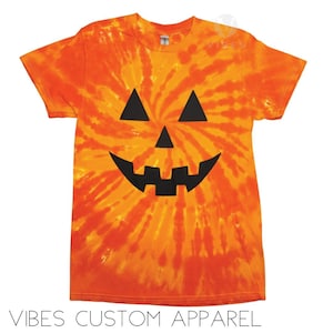 ユース ハロウィン オレンジとイエローのカボチャの顔 ジャック・オー・ランタン スパイラル タイダイ Tシャツ