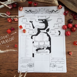 May include: A black and white printable character sheet for a dragon, with a cartoon dragon illustration. The sheet includes sections for stats, skills, features, and traits. There are also dice and a handwritten note that says "Look! A Dragon!"