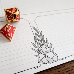 May include: Two red and gold dice with white numbers on a lined white paper background. The dice are a four-sided die with the numbers 1, 2, 3, and 4 and a twenty-sided die with the numbers 1, 2, 3, 4, 5, 6, 7, 8, 9, 10, 11, 12, 13, 14, 15, 16, 17, 18, 19, and 20. The paper has a drawing of a pile of crystals and leaves.