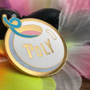 May include: Gold-colored enamel pin with a white background and a blue and pink swirl design. The word "POLY" is written in gold letters on the pin.