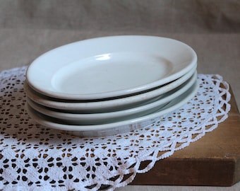 Juego de 4 platos apilables pequeños ovalados de porcelana antigua para restaurante o bistró francés.