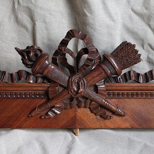 Antique french carved wood furniture pediment. Louis XVI motif Sculpted wood Architechtural salvage Ribbon bow torch arrows