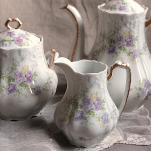 Set of 3 Antique french lavender flowers porcelain tea coffee set. Teapot sugar caddy cream pitcher. Shabby romantic tea set