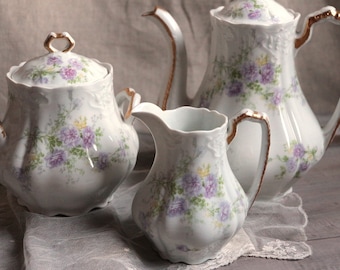 Set of 3 Antique french lavender flowers porcelain tea coffee set. Teapot sugar caddy cream pitcher. Shabby romantic tea set