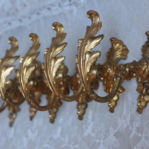 Set of 6 small light weight antique french gilded bronze ormoulu curtain tie hooks. Curtain hold back Louis XVI style French chateau chic