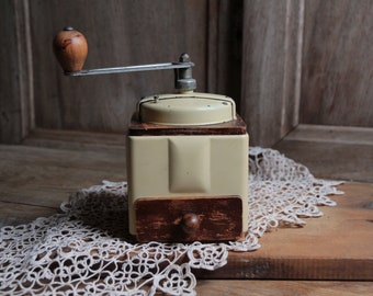 French vintage Peugeot frères manual coffee grinder. Cream Beige vanilla color metal. Pale yellow. French country kitchen.