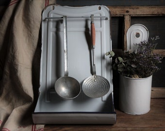 Antique french white enamel utensil rack with metal utensils and extra utensil holder. White kitchen enamelware set. Rustic kitchen decor