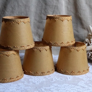 Set of 5 french antique clip on faux-vellum plastic lamp shades with gold passmenterie trim for small light bulbs