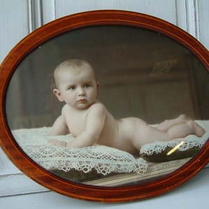 Antique french hand colored black and white baby photo portrait in oval marquetry frame. 1920-30s  Sepia tone photos. Shabby french decor