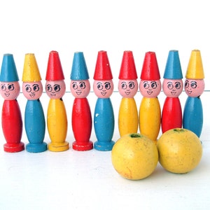 French vintage set of small painted wooden bowling skittles game with two yellow balls. New Old Stock. Never used