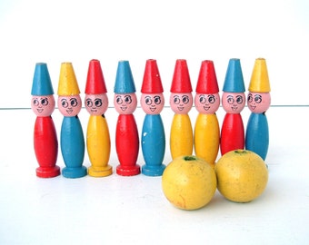 French vintage set of small painted wooden bowling skittles game with two yellow balls. New Old Stock. Never used