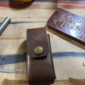 May include: A set of three ceramic mugs with a speckled, matte finish. Each mug features a different color: light blue, cream, and gray. The mugs have a simple, modern design and a comfortable handle.