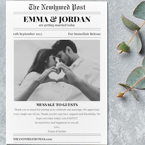 May include: A black and white photo of a couple holding hands in the shape of a heart. The photo is framed in a newspaper-style layout with the headline "The Newlywed Post" and the text "Emma & Jordan are getting married today." The date "15th September 2023" and "For Immediate Release" are also included. The text "MESSAGE TO GUESTS" is below the photo, followed by a message of thanks to guests for attending the wedding.