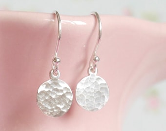 battered silver earrings