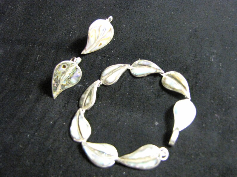 Lovely leaf shaped abalone in sterling setting. Bracelet and screw back earrings MEXICAN sterling Set