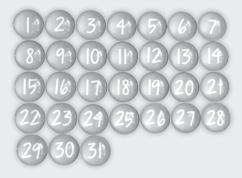 May include: Thirty-one round, gray, numbered tokens with white numbers. The tokens are arranged in a grid pattern.