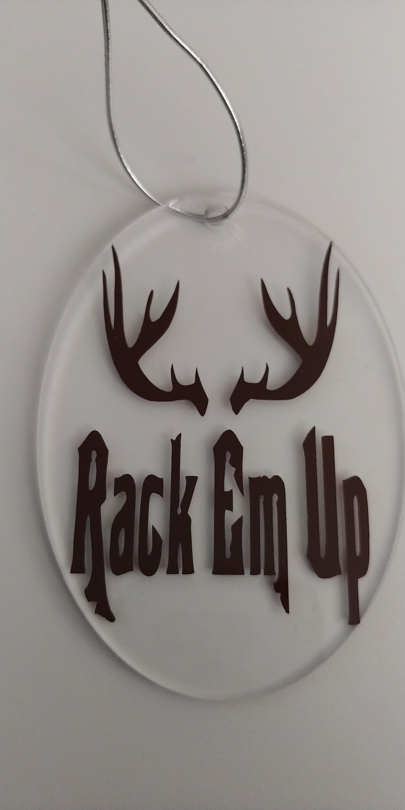Oval shaped plastic hunting theme Christmas ornament