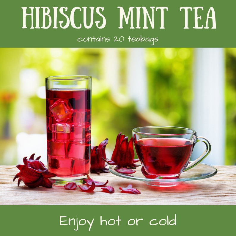 May include: A glass of iced hibiscus mint tea with ice cubes and a cup of hot hibiscus mint tea. The tea is a vibrant red color and is surrounded by dried hibiscus flowers. The text "Hibiscus Mint Tea" and "contains 20 teabags" is at the top of the image. The text "Enjoy hot or cold" is at the bottom of the image.