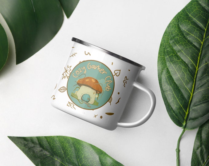 Cozy Gamer Club Enamel Mug: Mushroom House Design, Gift for Video Gamers