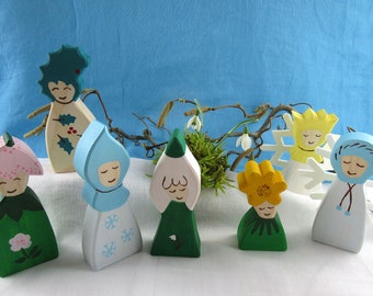 DIY / instruction / scrollsaw patterns / plans for making 7 different wooden figures as flower children: snowflake, holly, ...