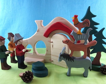 May include: A wooden toy set featuring a house with a red roof, a donkey, a dog, a cat, a rooster, and three people. The house has a door and windows. The animals are stacked on top of each other.