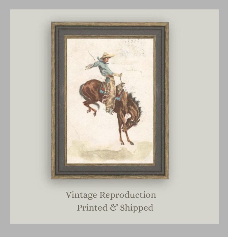 Antique Western art print featuring cowboy on bucking horse from “In the Saddle.” Rustic Americana artwork perfect for cowboy nursery décor, ranch-inspired homes, farmhouse walls, and vintage art collectors seeking Western heritage prints.