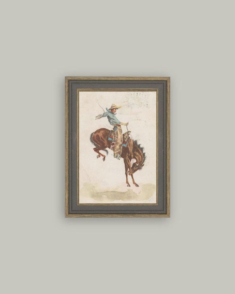 Vintage Western cowboy art print titled “In the Saddle” featuring a bronc rider on a bucking horse. Antique postcard illustration perfect for rustic ranch décor, cowboy wall art, Western nursery themes, or masculine home office styling. High-resolution vintage reproduction ideal for collectors.