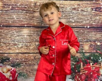 Satin family Christmas pyjamas in red or green with matching dog bandanas