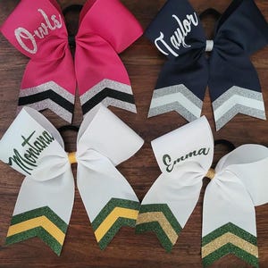 WHITE RIBBON with dark green/gold/dark green AND dark green/athletic yellow/dark green
Hot Pink ribbon with silver/black/silver
Navy ribbon with silver/white/silver