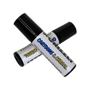 May include: Two black roll-on bottles with white labels. The label on one bottle says "Cartoons & Cereal Pick-Me-Up Refresher". The label on the other bottle says "Cereal Refresher".