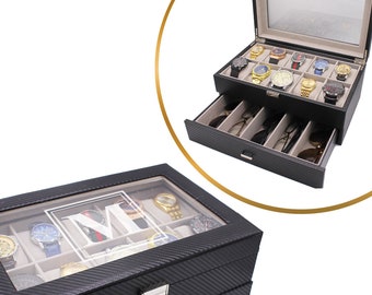 May include: Black watch box with a glass top and two drawers. The box has a carbon fiber pattern and a white monogram "M".
