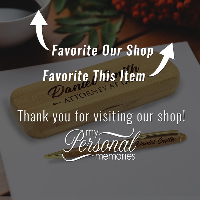 May include: A wooden box with a gold pen inside. The box is engraved with the text "Favorite This Item Daniel Attorney at Law". The pen is engraved with the text "my Personal memories Daniel Smith".