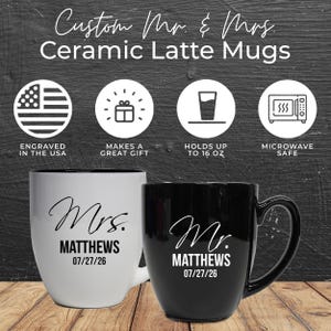 May include: Two ceramic latte mugs, one white and one black, with the text "Custom Mr. & Mrs." and the names "Mrs. Matthews" and "Mr. Matthews" with the date 07/27/26. The white mug has a black interior. The mugs hold up to 473 ml.