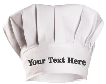 May include: White chef hat with the text "Your Text Here" printed on the front.