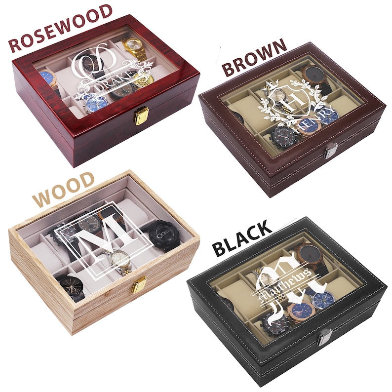 May include: Four rectangular watch display cases with glass lids and internal compartments. The cases are finished in rosewood, brown, light wood, and black. Each lid features white personalized text and graphics, including the names Drake, Henry, M, and Matthews.