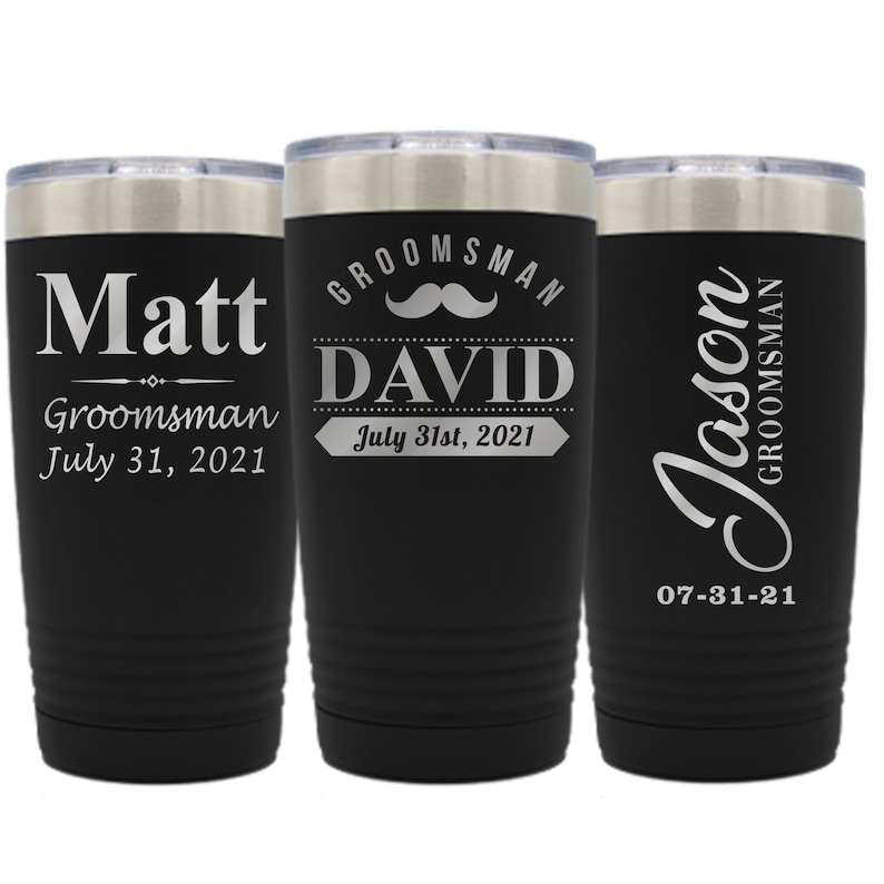 May include: Three black stainless steel tumblers with personalized text and a mustache graphic. The tumblers read "Matt Groomsman July 31, 2021", "Groomsman David July 31st, 2021", and "Jason Groomsman 07-31-21".