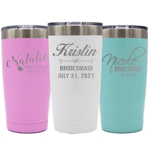 May include: Three stainless steel tumblers with personalised names and the word "bridesmaid" on each. The tumblers are pink, white and turquoise.